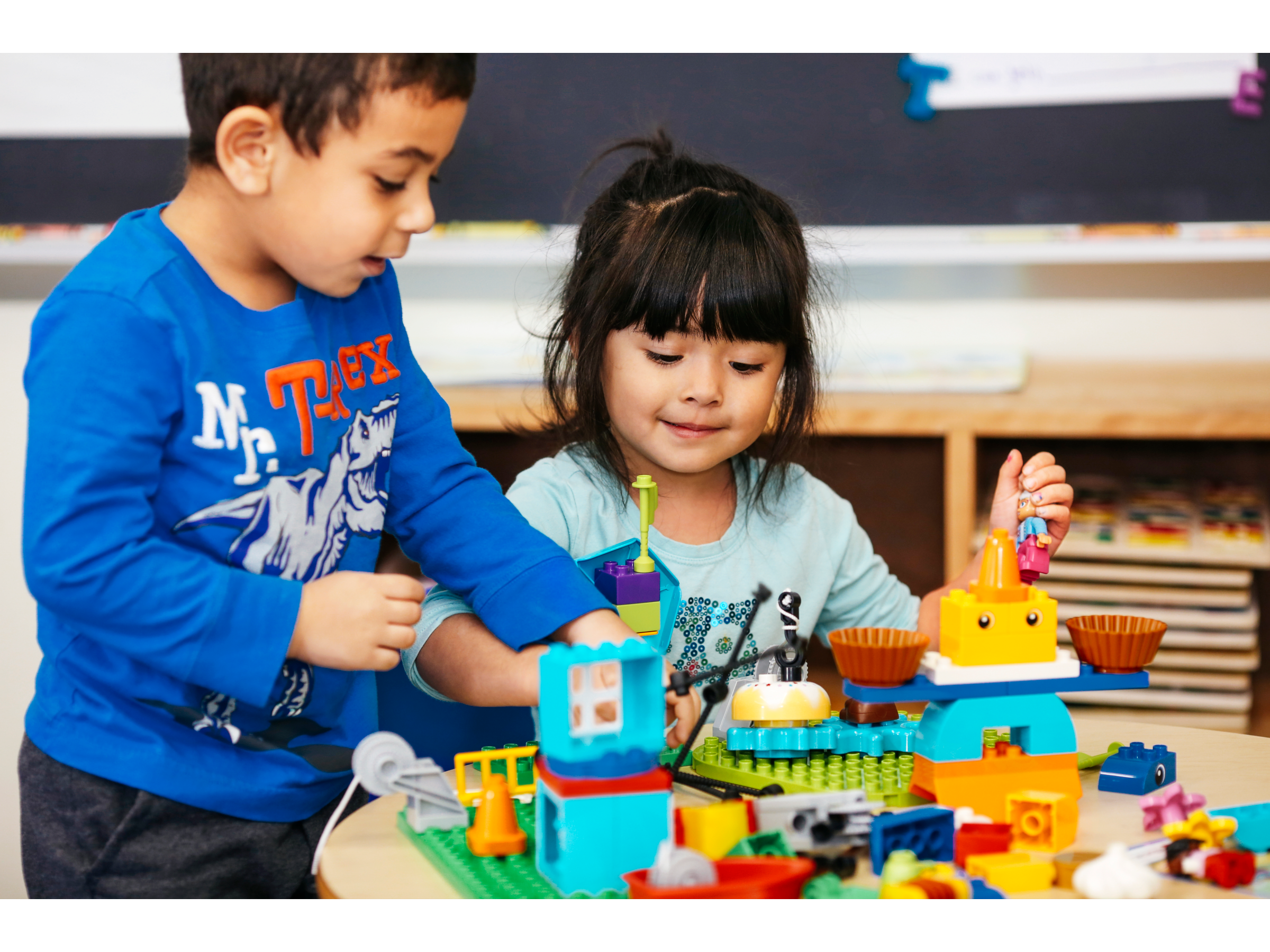 Students learning with a kindergarten STEAM kit